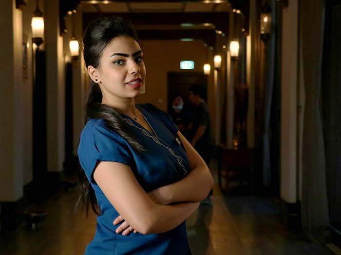 nurse standing in a dark hospital ward